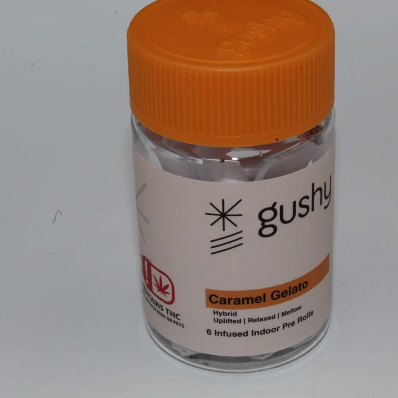 Caramel Gelato jar with its orange lid, label reading Hybrid, Uplifted, Relaxed, Mellow